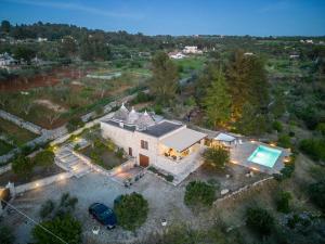 an overhead view of a house with a swimming pool at Trulli Oasis in Noci