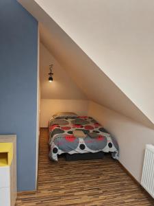 a bedroom with a bed in a attic at Oko na Mogielice in Słopnice