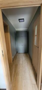 an empty room with a door and a hallway at BŁĘKITNA 37 apartamenty in Kołobrzeg