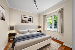 a bedroom with a large bed and a window at Sunset Paradise in Pontud