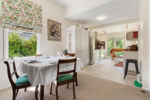a kitchen and dining room with a table and chairs at Sunset Paradise in Pontud +20 photos
