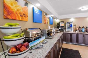a kitchen with bananas and apples on a counter at Comfort Inn in North Bay +55 photos