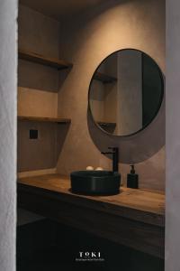 a bathroom with a sink and a mirror on a counter at Toki Boutique Hotel Tam Đảo in Tam Ðảo +32 photos