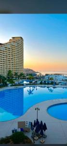 a view of a large swimming pool with a resort at بورتو السخنه الاهرامات in Ain Sokhna