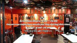 a restaurant with tables and chairs in a room at THE STAR HOTEL - PHU MY HUNG, HO CHI MINH - Korean Buffet Breakfast in Ho Chi Minh City