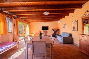 a living room with a table and a couch at Villa Tiffany in Marsala