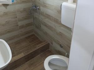 a bathroom with a toilet and a sink at Sumski raj Gornje podunavlje in Sombor +21 photos