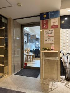 a door leading into a store with a table and chairs at Universal Haneda in Tokyo