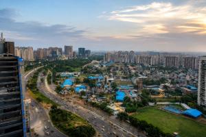an aerial view of a city with traffic at Pillowtalks Cloudnine Stays in Ghaziabad