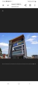 a picture of a building with a sign on it at Hotel nsb square in Dehradun
