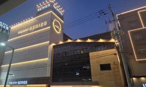 a building with a clock on the top of it at The Stay Series in Daegu