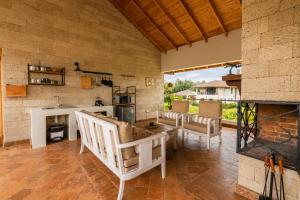 a living room with a couch and a fireplace at The Landing Cottages Family Suite 2 Bedroom in Nanyuki