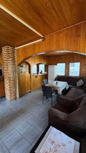 a living room with a couch and a table at Cabana Dara in Cumpăna