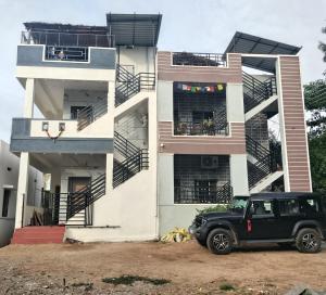 a black truck parked in front of a building at VIDYA Homestay in Hampi