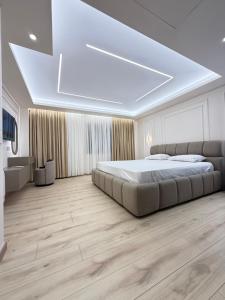 a bedroom with a large bed in a room at Old Town Inn room 9 in Pogradec