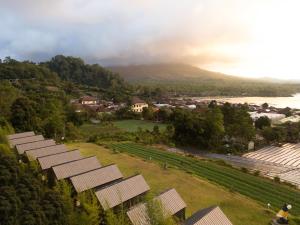 a row of solar panels in front of a mountain at Royal Indah Glamping Kintamani in Kintamani