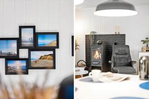 a living room with a chair and a fireplace at LF16124-Farso-Bjarkesvej-4 in Farsø