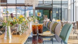a long table with drinks and a plate of food at Mu-an Prejong Dokchae Pension in Muan