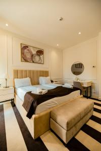 a hotel room with two beds and a desk at HOTEL BALKAN in Bijeljina