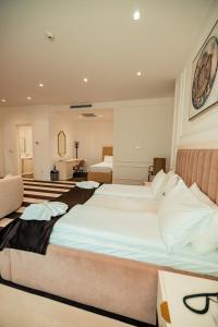 a large bedroom with two beds in a room at HOTEL BALKAN in Bijeljina +10 photos