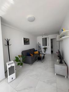 a living room with a couch and a table at Marys Place in Costa Del Silencio