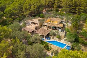 an aerial view of a house with a swimming pool at Can Xilla by Sealand Villas in Alcudia