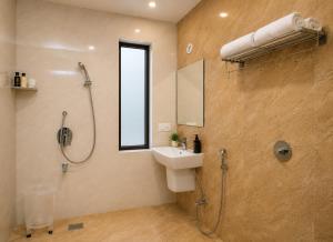 a bathroom with a shower and a sink and a shower at Amritara Ramila Kutir Ayodhya in Ayodhya +36 photos