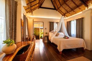 a bedroom with a bed in a room at The Kokomo Siargao in General Luna +42 photos
