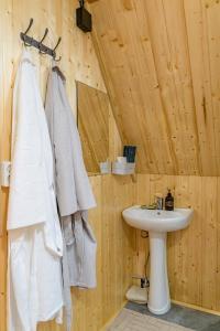 a bathroom with a sink and a toilet and a sink at A-frame Sky in Karakol +11 photos