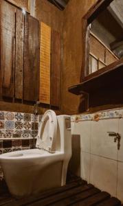 a bathroom with a toilet and a sink at Nhiên Café & Homestay in Xuân Trường +40 photos