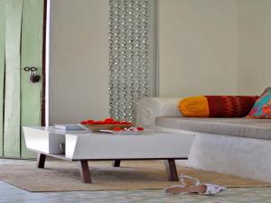 a living room with a coffee table and a couch at DanCenter Parijat Villas & Suites Udaipur in Udaipur