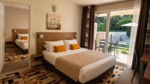 En eller flere senge i et værelse på Forme-hotel & Spa Montpellier Sud-Est - Parc Expositions - Arena + 49 billeder