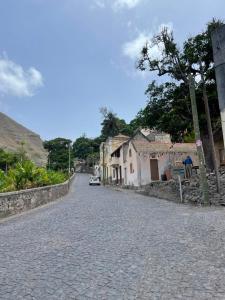 a cobblestone street in a small town with buildings at Refúgio NO Stress in Paul