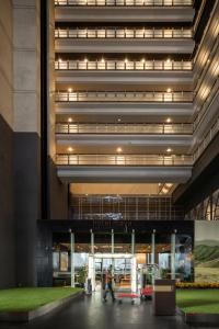 a rendering of the front of a hospital with people walking into the building at Hotel Maya Kuala Lumpur City Centre in Kuala Lumpur