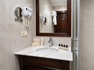 a bathroom with a sink and a mirror at Midway Park Hotel in Baku +38 photos