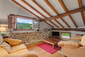 a living room with a couch and a table at Casa Del Tesoro in Triongo