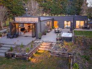 a small house with a garden and a patio at 5 o'clock somewhere in Masterton
