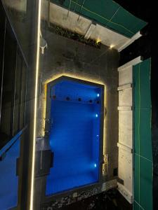a large blue door in a room with a wall at Villa Stay in Pondicherry