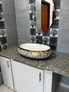 a bathroom with a sink and a mirror on a counter at Villa Stay in Pondicherry +4 photos