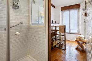 a bathroom with a walk in shower and a ladder at La Prairie de Vassy in Vassy +50 photos