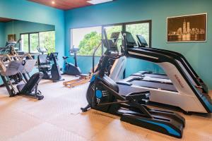 a gym with several treadmills and cardio machines at Z Exquisite Koh Samui Domain with Infinity Pool in Nathon Bay