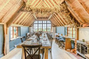 a dining room with a long table and chairs at 5 Bed in Bishops Lydeard oc-b45427 in  Liscombe
