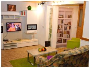a living room with a couch and a table at Ferienwohnung Waldraff in Ostrach