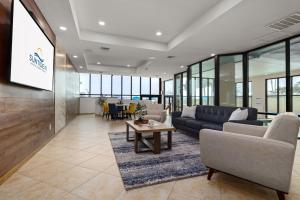 an office lobby with a couch and a table at Updated 3BR w/ Gulf Views: Suntide III - Unit 801 in South Padre Island