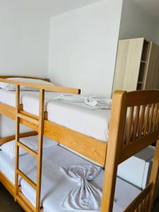 a pair of bunk beds in a room at Apartament bisaku in Shëngjin