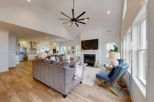 a living room with a couch and a fireplace at Sapphire Sol in Ocean City