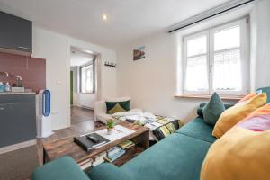 a living room with a couch and a table at A9 City Boardinghouse ,WiFi , Parking, VAT Invoice in Günzburg
