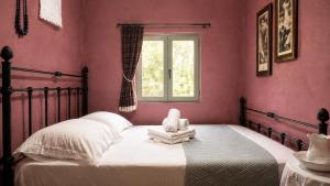 a bedroom with a bed with a stuffed animal on it at The Blue - Kythira in Kondoliánika