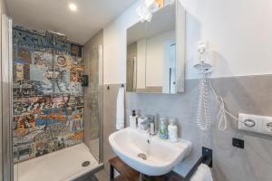 a bathroom with a sink and a shower at A9 City Boardinghouse ,WiFi , Parking, VAT Invoice in Günzburg +84 photos