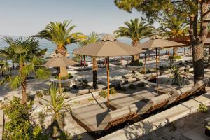 an overhead view of a beach with chairs and umbrellas at Le Meridien Lav Split in Podstrana